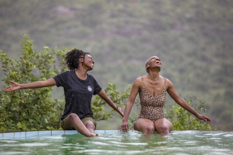 G Adventures Kenya Il Negwesi Lodge Geluxe CEO and female traveller on edge of pool MG 2040