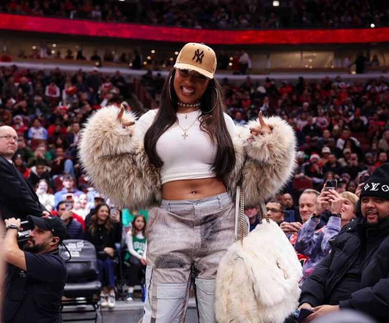 9 Megan Thee Stallion Attends the Bulls vs Celtics Game in a DSquared Fur Coat Who Decides War Cargo Pants and a YSL Niki Oversized Fur Bag copy