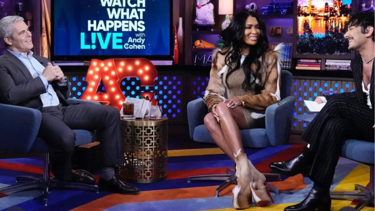 Brit Eady Appeared on WWHL in a Brown Vintage Roberto Cavalli Dress with a Dior Handbag and Christian Louboutin Boots 6