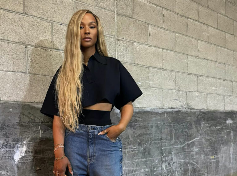 Savannah James Attends Basketball Game Wearing an Alaia Cropped Black Polo Shirt Snap Denim Jeans Louis Vuitton Green Speedy and Bottega Veneta Mules copy