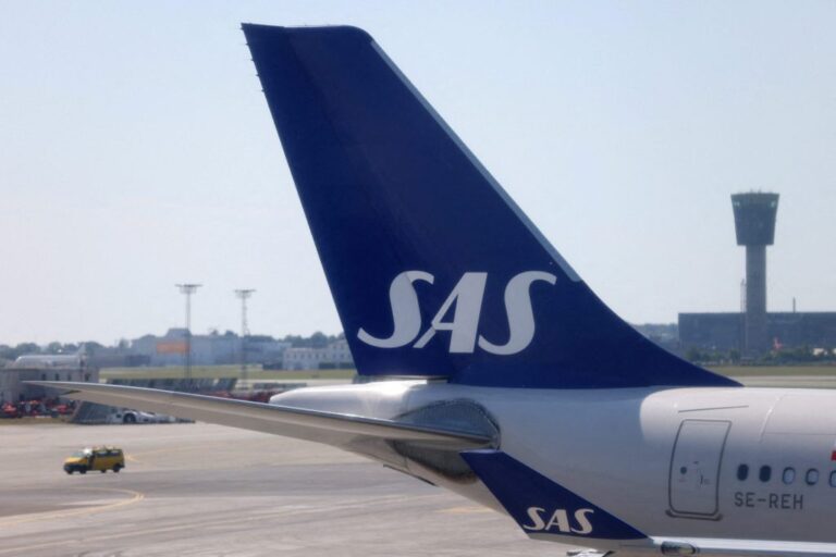 FILE PHOTO The tail fin of Scandinavian Airlines SAS airplane parked on the tarmac at Copenhagen Airport Kastrup in Copenhagen scaled