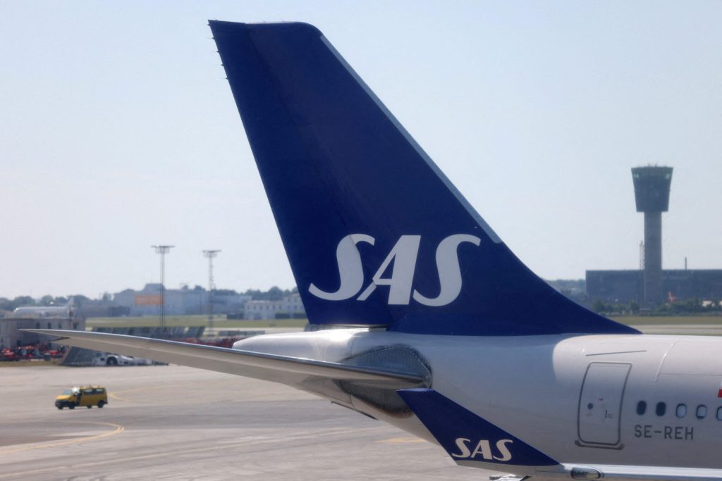 FILE PHOTO The tail fin of Scandinavian Airlines SAS airplane parked on the tarmac at Copenhagen Airport Kastrup in Copenhagen scaled